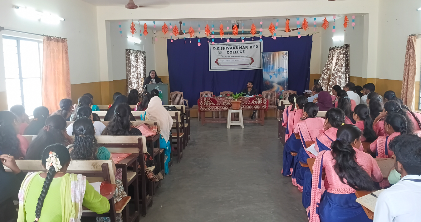 Opening session — dignitaries on dais, D.K. Shivakumar B.Ed. College, Apr 2026